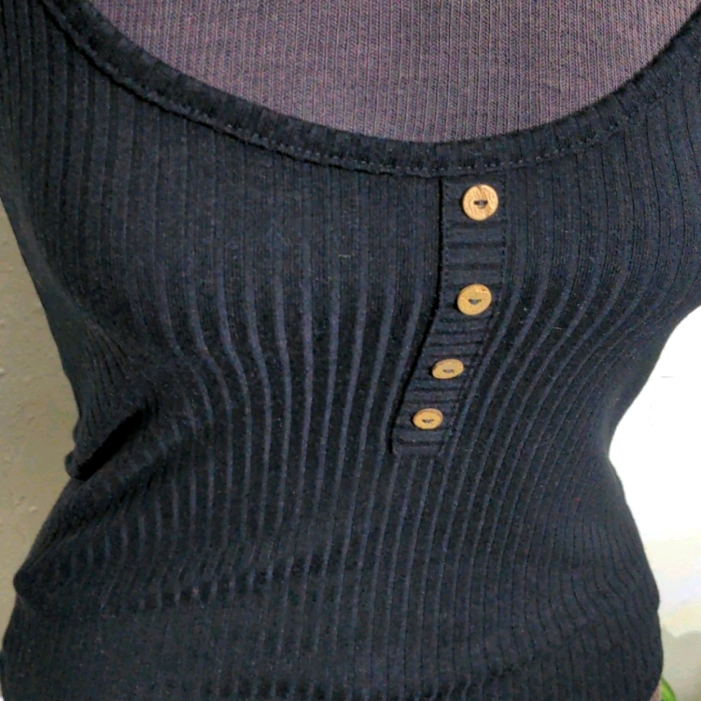 Orange Kiss Black Tank Top runs really small.